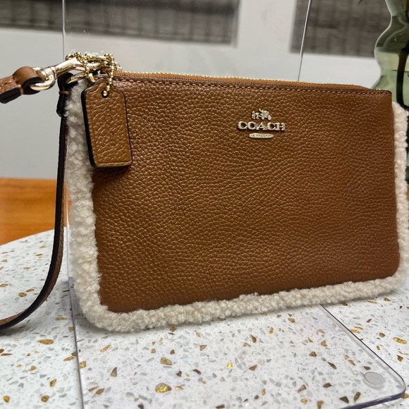 Coach Handbags - Coach Brown Leather and Sherpa Trim Large Wristlet